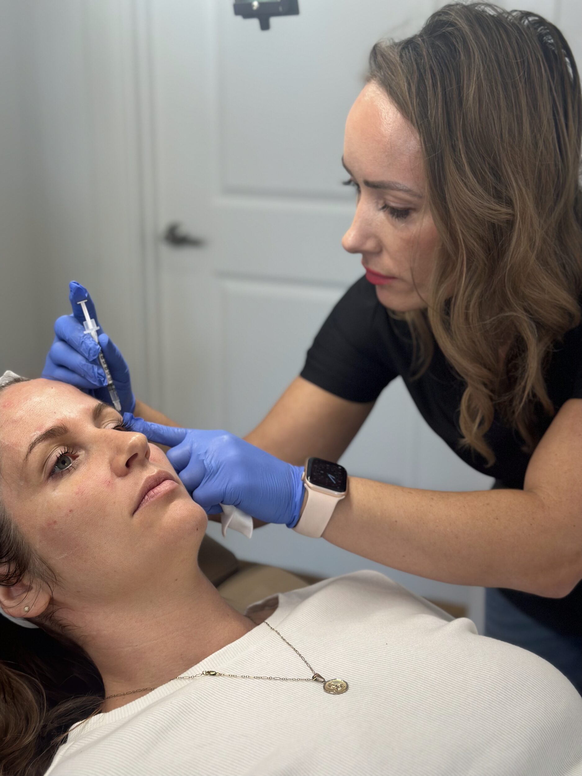 Katrina performing a Botox injection at Third Eye Beauty Lounge in Tempe, Arizona, helping a client achieve smooth, natural, and youthful results.