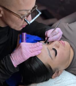 Kayla Marie expert brow artist performing ombre brow service at Third Eye Beauty Lounge in Tempe, AZ
