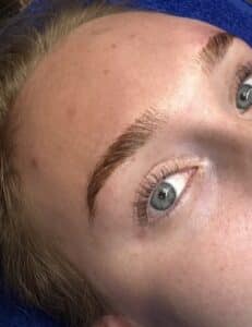 Alt Text:Close-up of freshly laminated fluffy brows on a client at Third Eye Beauty Lounge in Tempe, AZ