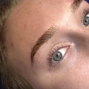Close-up of freshly laminated fluffy brows on a client at Third Eye Beauty Lounge in Tempe, AZ