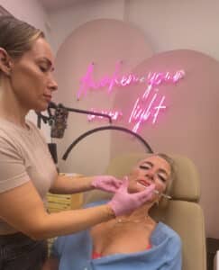 Cosmetic Nurse Injector Katrina at Third Eye Beauty Lounge in Tempe, AZ performing a precise Botox injection for natural wrinkle reduction and facial rejuvenation.