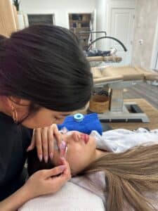Performing a Korean lash lift at Third Eye Beauty Lounge in Tempe AZ showing precise rod placement and customized lash lifting technique